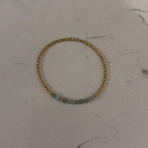 E Newton bracelet with light blue beads